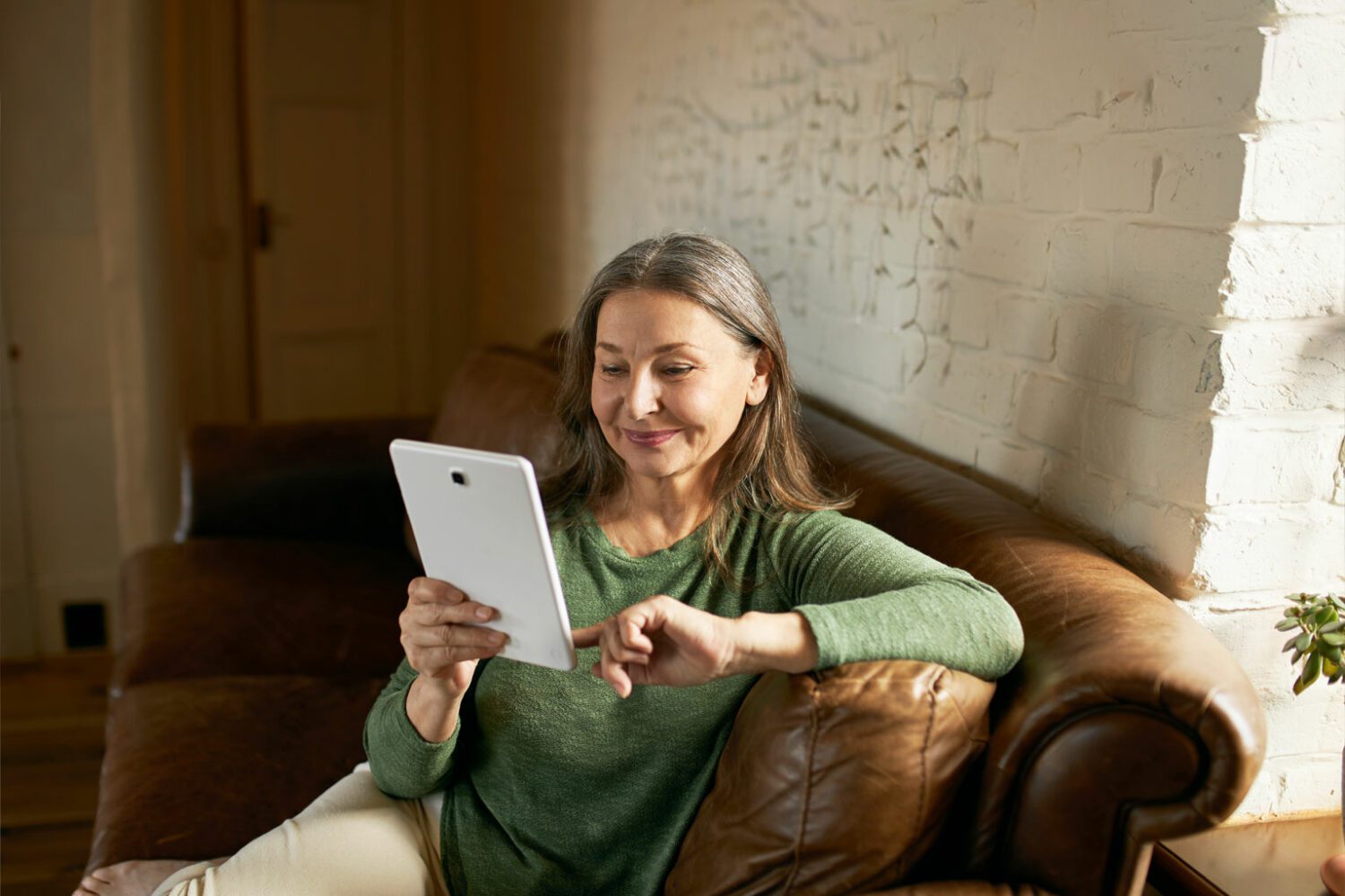 mature woman on tablet