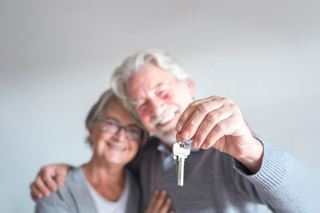 mature couple with house key