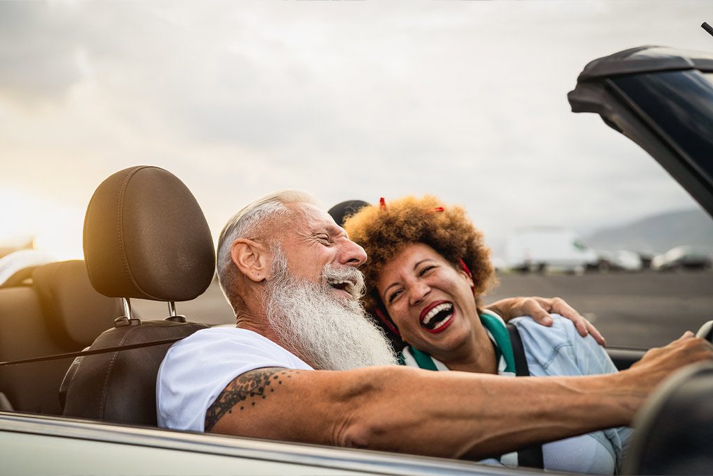 happy mature couple in a car